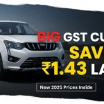 Mahindra XUV700 SUV with bold text ‘BIG GST CUT! SAVE ₹1.43 LAKH – New 2025 Prices Inside’ on a bright background, highlighting the new GST-reduced price.